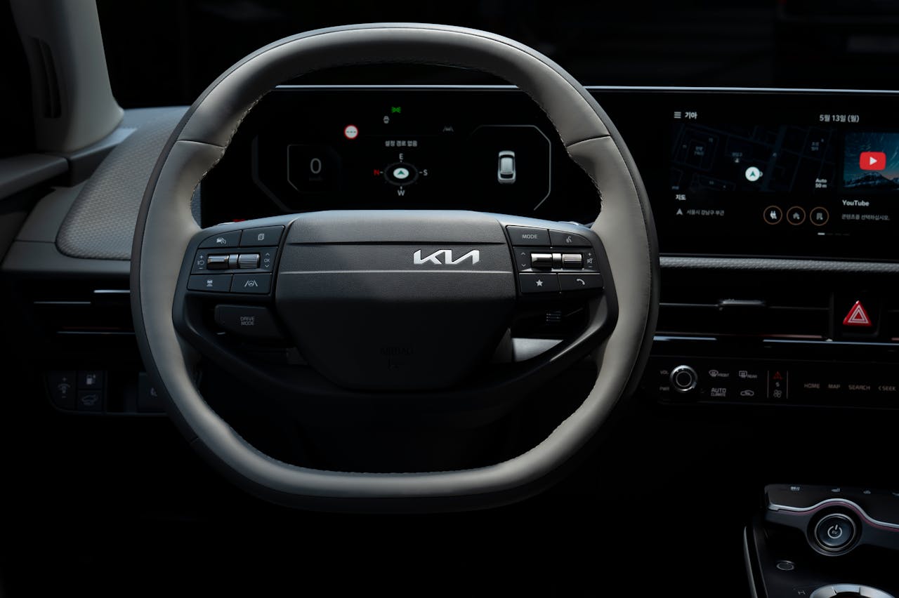 Close-up view of the Kia EV's steering wheel showcasing its modern design and technology.